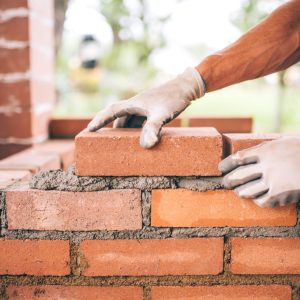 Brick specialist laying bricks